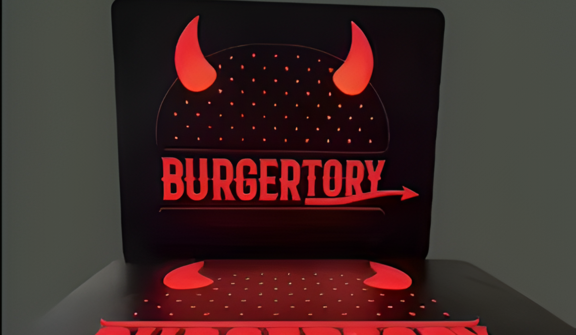 Leuchtendes BURGERTOY-Logo mit roten Teufelshörnern auf schwarzem Hintergrund